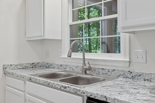 a view of a room with a large window