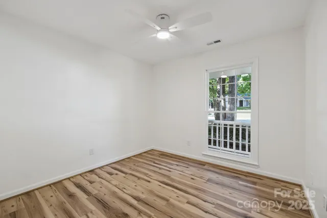 a view of a livingroom with wooden floor