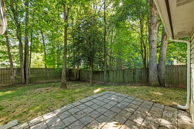 a view of a house with a small yard