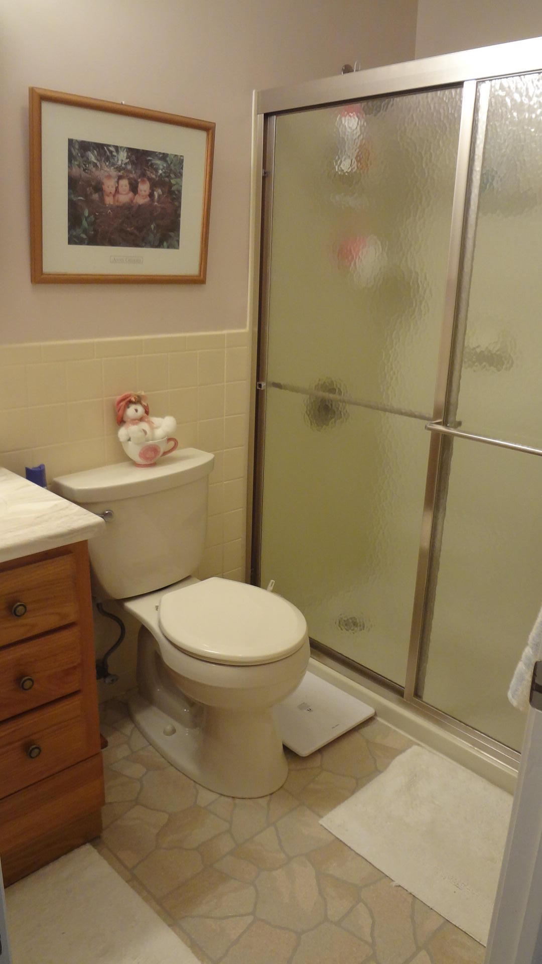 683 Old Post (rt 6a Main St ) Road, Unit 16 Dennis, MA 02638 - Photo 12 of 23 a bathroom with a toilet and a shower
