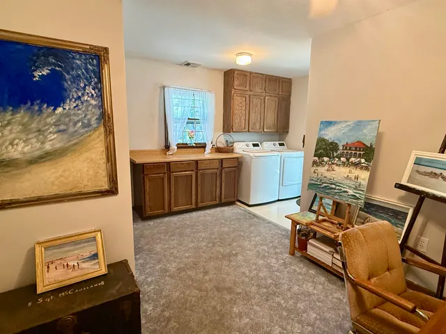 a utility room with a sink washer and dryer
