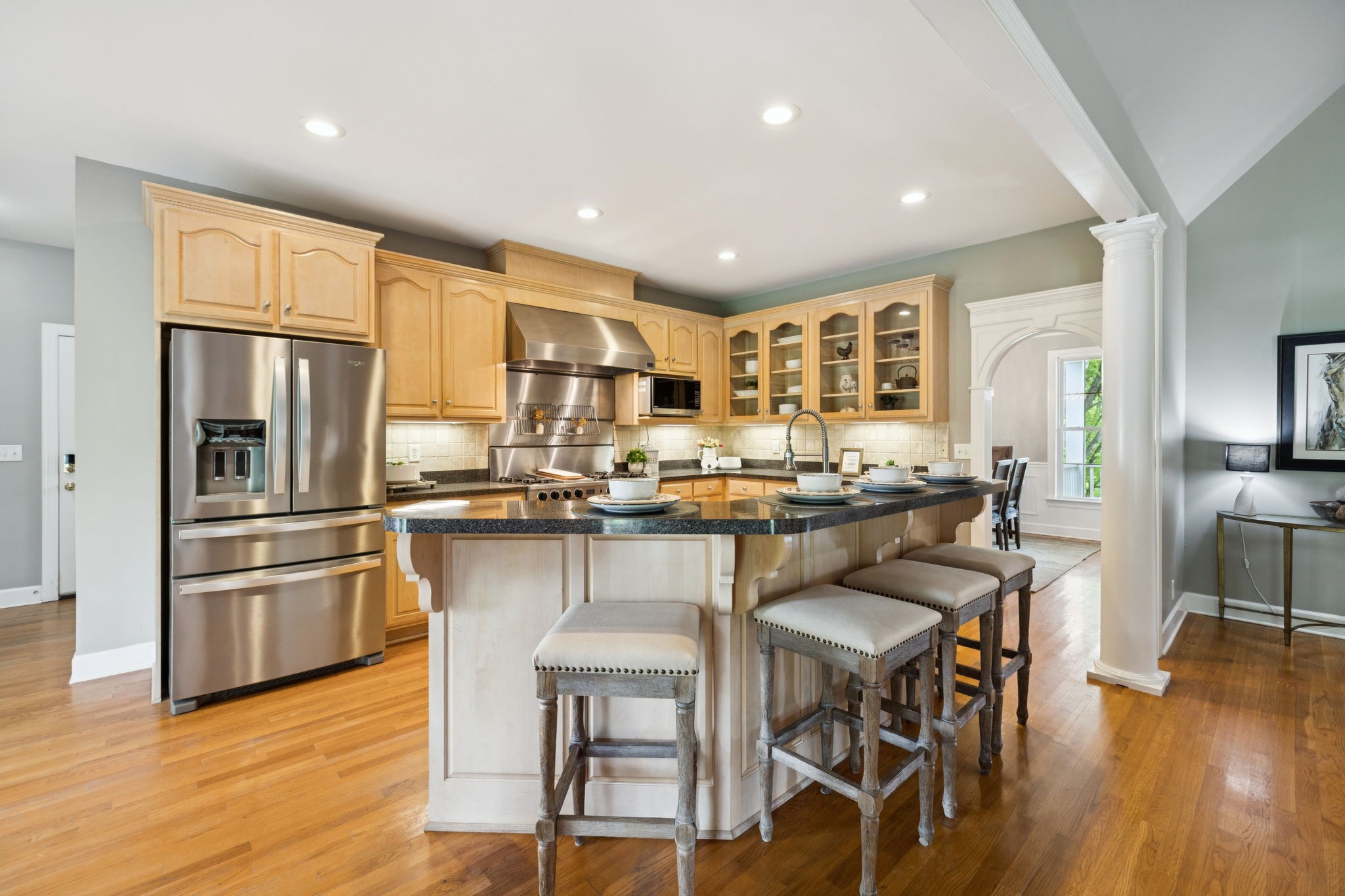1387 Floyd Road Eagleville, TN 37060 - Photo 31 of 100 a kitchen with stainless steel appliances a table chairs refrigerator and sink