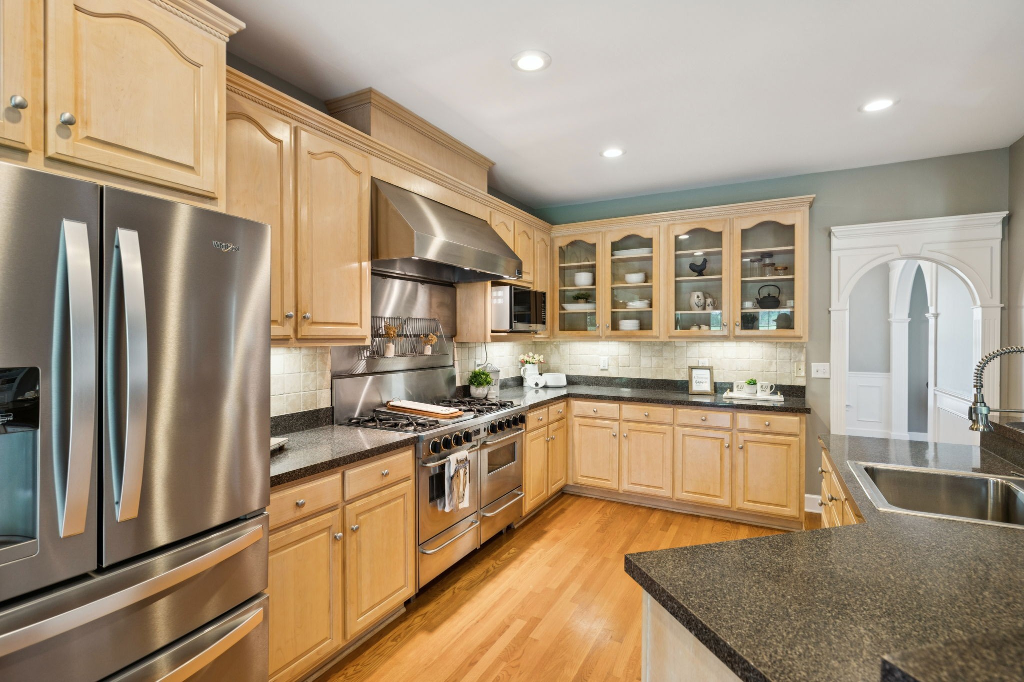 1387 Floyd Road Eagleville, TN 37060 - Photo 34 of 100 a kitchen with stainless steel appliances granite countertop a refrigerator a stove and a sink with wooden floor