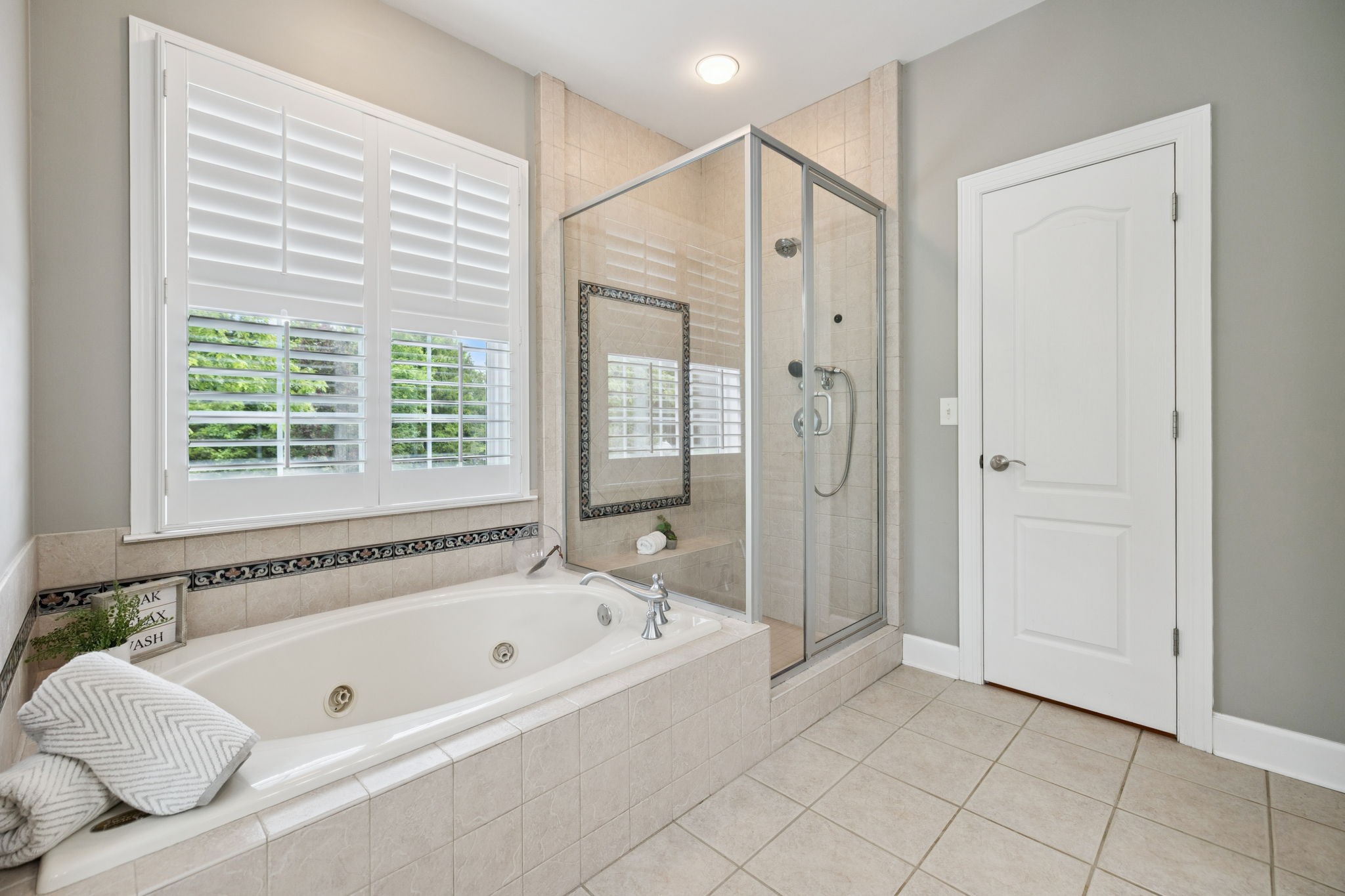 1387 Floyd Road Eagleville, TN 37060 - Photo 47 of 100 a bathroom with a bathtub and a shower