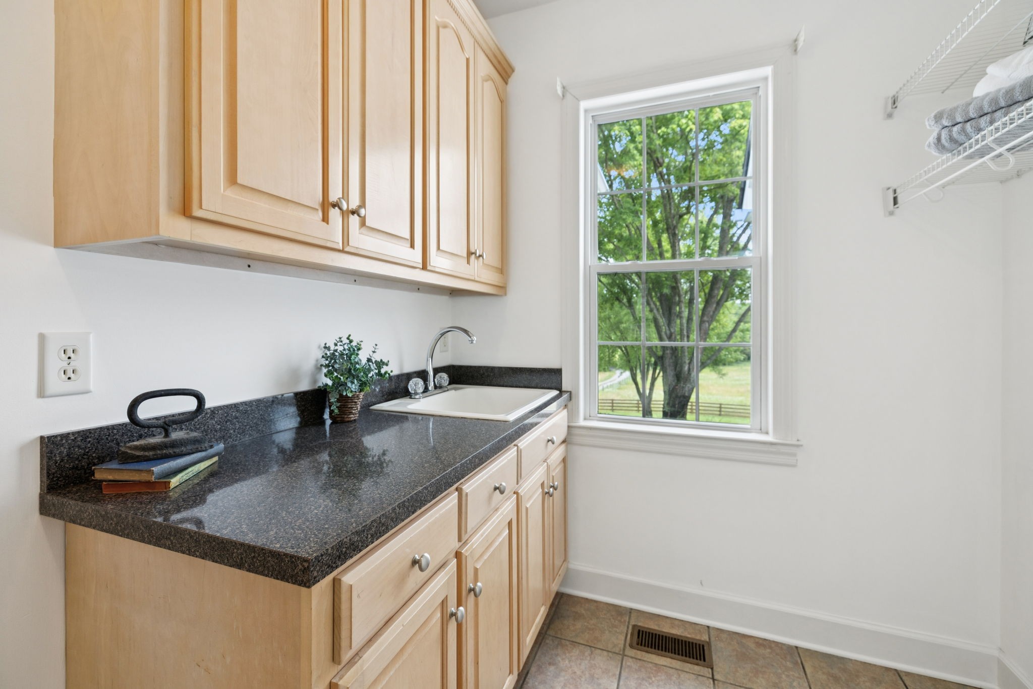 1387 Floyd Road Eagleville, TN 37060 - Photo 53 of 100 a kitchen with stainless steel appliances granite countertop a sink and a window