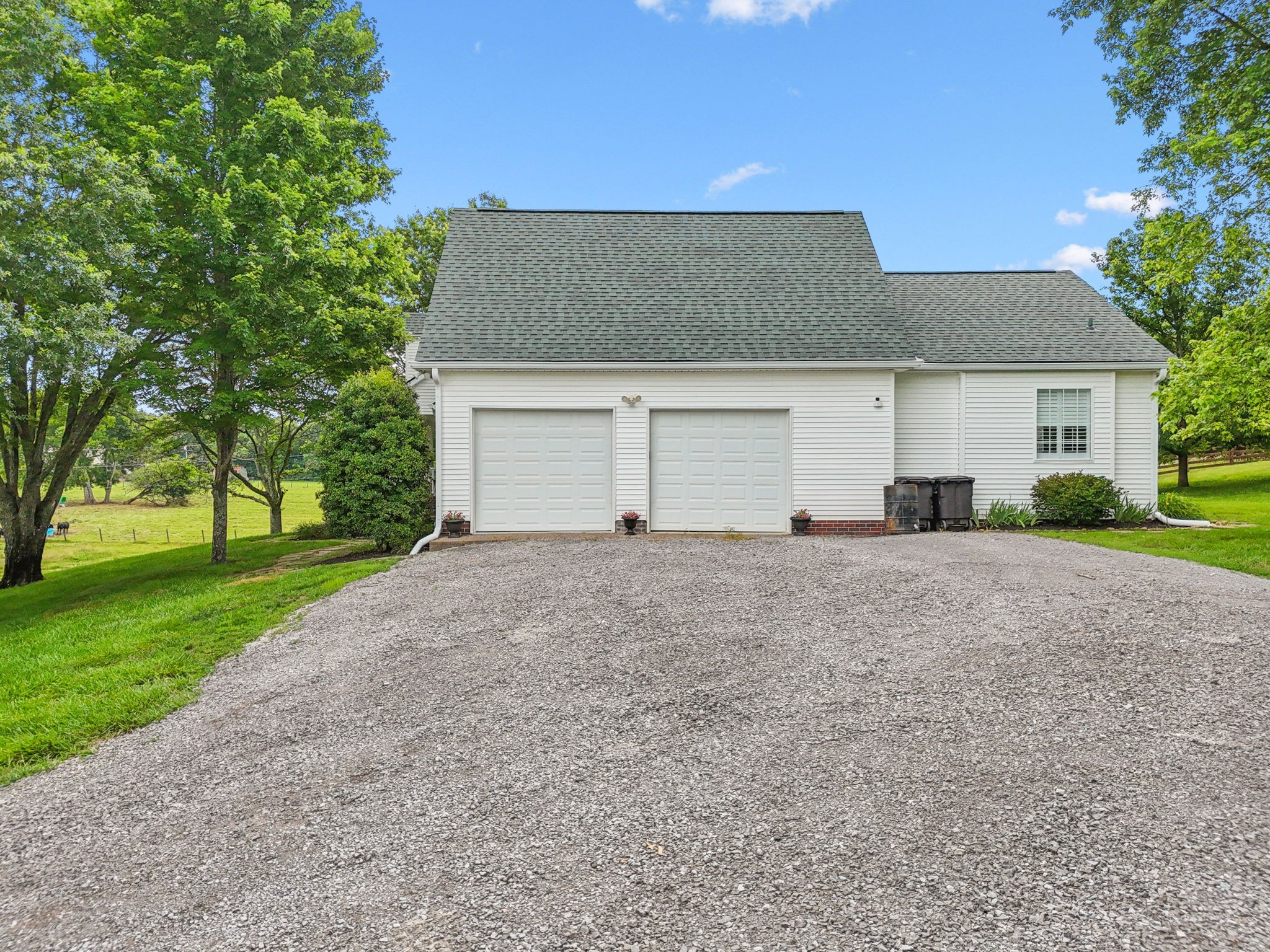 1387 Floyd Road Eagleville, TN 37060 - Photo 67 of 100 a front view of house with yard and trees all around