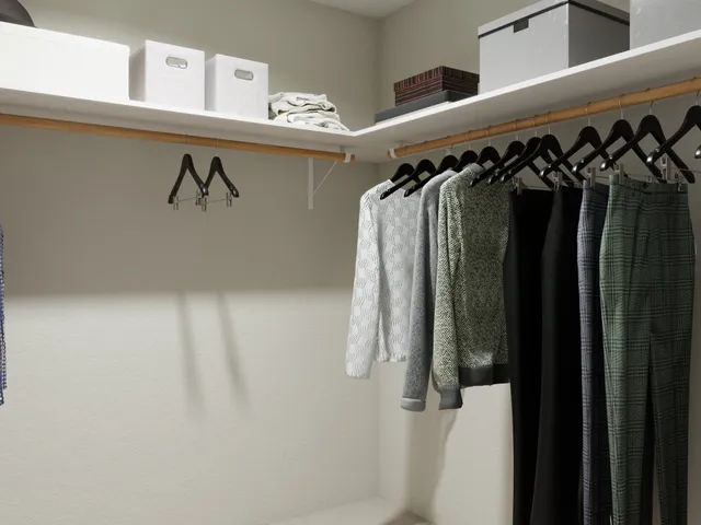 a swimming pool with outdoor seating and outdoor shower