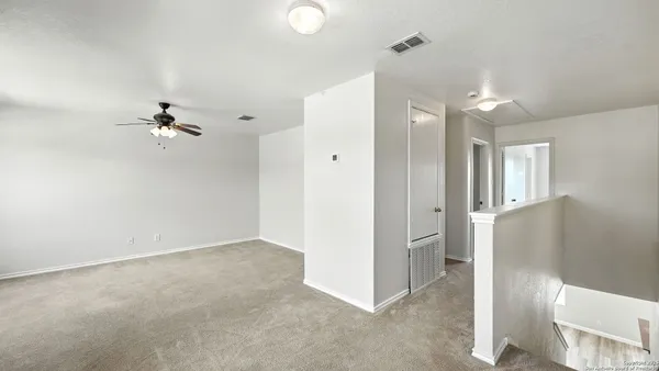 wooden floor in an empty room and a window