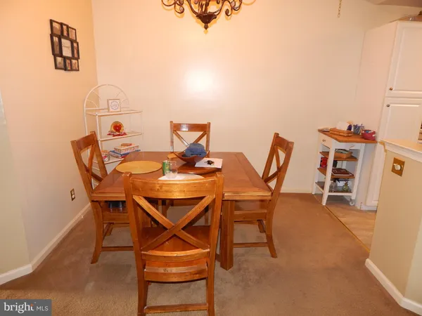 a dining room with a table and chairs