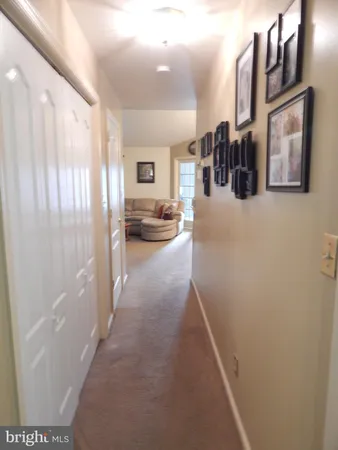 a view of a hallway with windows