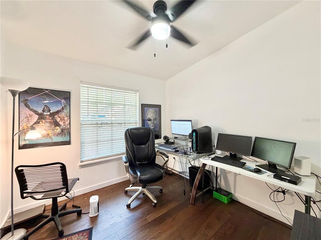 421 Northwest 48th Boulevard Gainesville, FL 32607 - Photo 14 of 26 a view of a workspace with furniture and a window