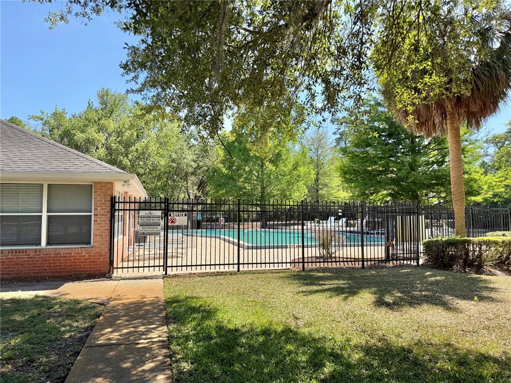 421 Northwest 48th Boulevard Gainesville, FL 32607 - Photo 21 of 26 a view of a backyard with a large tree