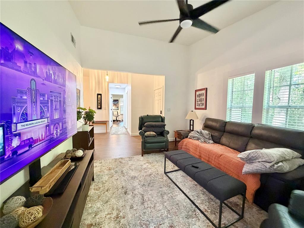421 Northwest 48th Boulevard Gainesville, FL 32607 - Photo 7 of 26 a living room with furniture and wooden floor