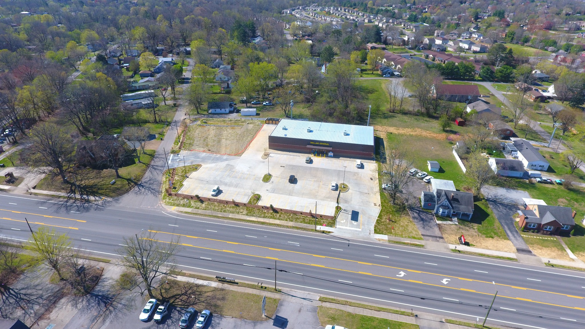 an aerial view of residential houses with outdoor space