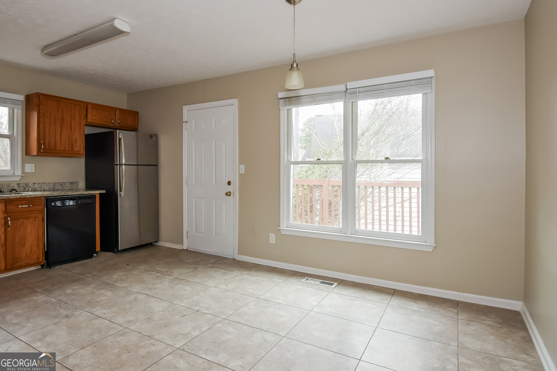 162 Aztec Way Southeast Acworth, GA 30102 - Photo 5 of 17 a view of an empty room with a kitchen