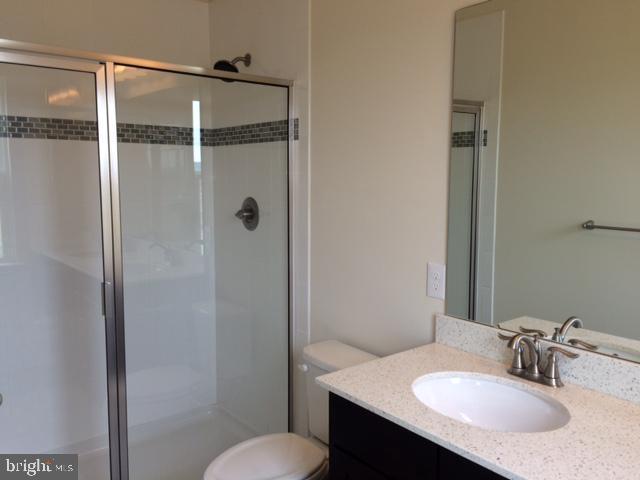 203 Quarry Point Road Malvern, PA 19355 - Photo 16 of 23 a bathroom with a sink toilet vanity and shower