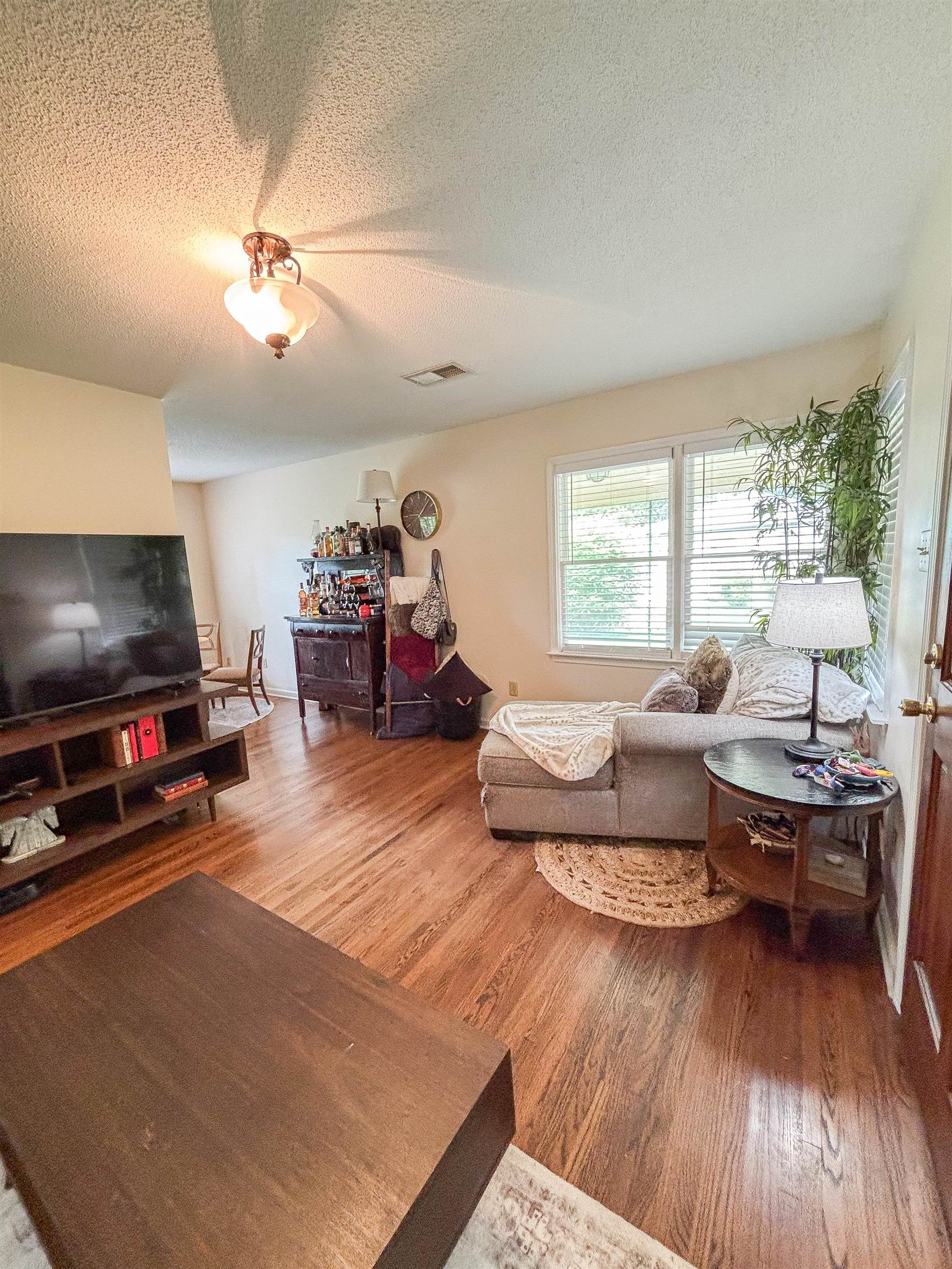 5339 Virgil Road Bartlett, TN 38134 - Photo 6 of 25 a living room with furniture and a flat screen tv