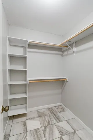 a view of a room with shelf on the wall