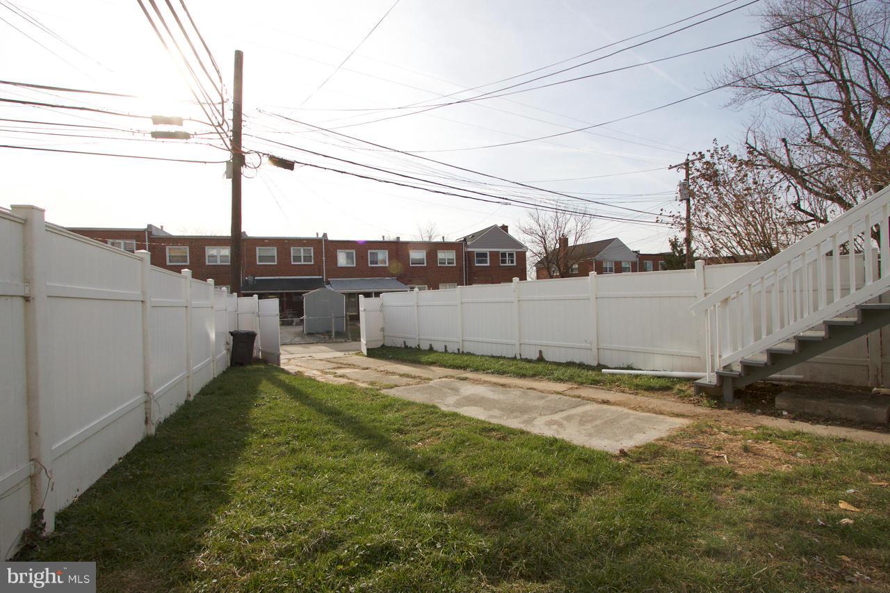 1261 Deanwood Road Baltimore, MD 21234 - Photo 22 of 22 a backyard of a house with lots of green space