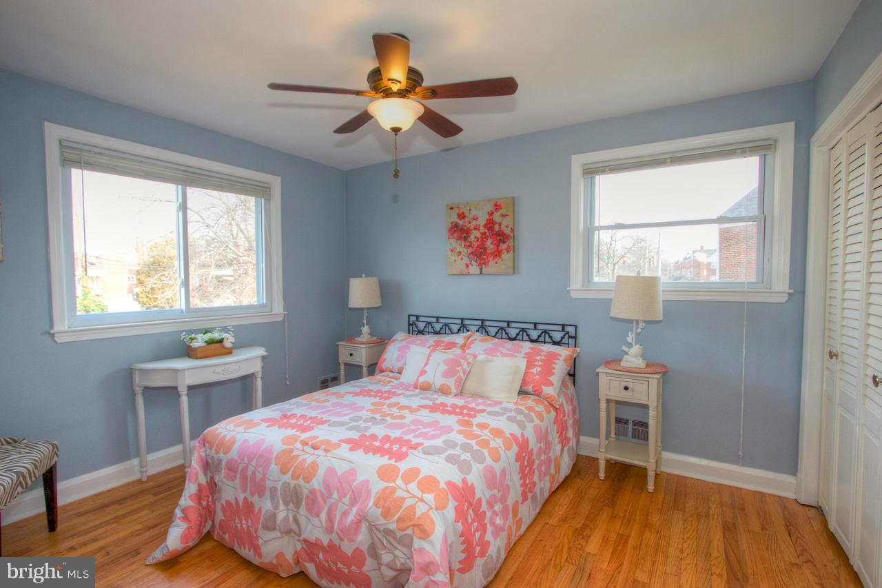 1261 Deanwood Road Baltimore, MD 21234 - Photo 4 of 22 a bedroom with a bed and a chandelier
