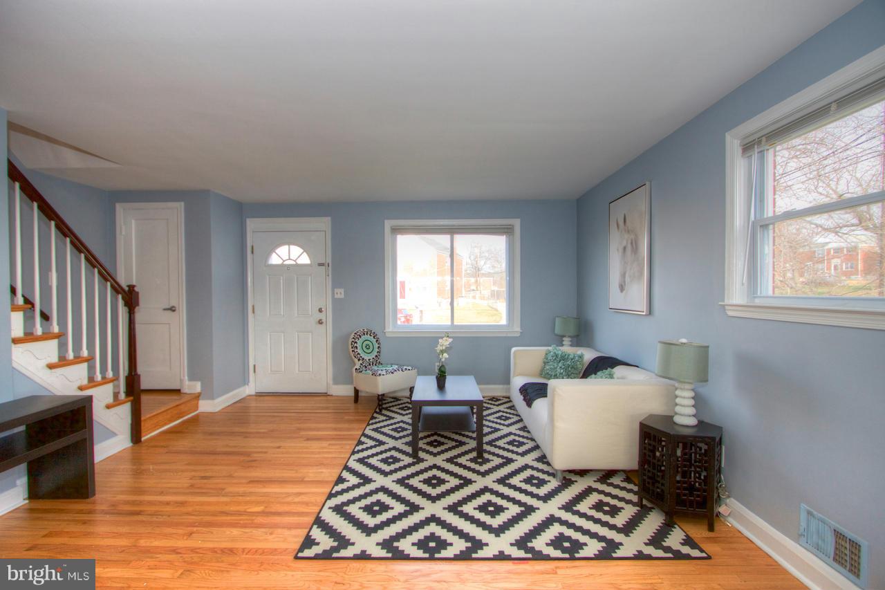 1261 Deanwood Road Baltimore, MD 21234 - Photo 8 of 22 a living room with furniture window and wooden floor