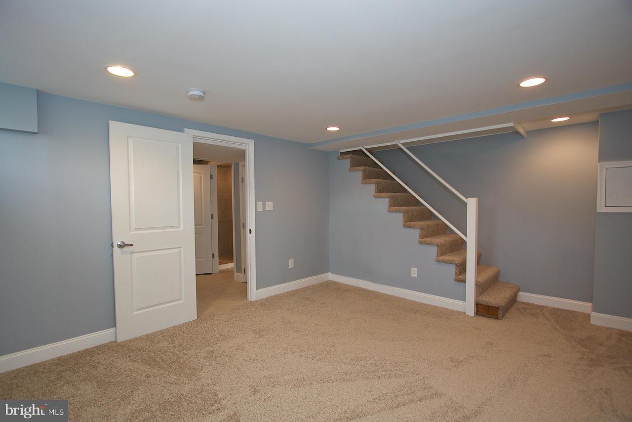 1261 Deanwood Road Baltimore, MD 21234 - Photo 9 of 22 a view of an empty room with stairs