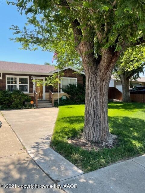 5003 Parker Street Amarillo, TX 79110 - Photo 1 of 20 a front view of a house with a yard