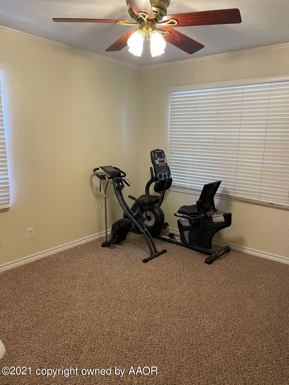 5003 Parker Street Amarillo, TX 79110 - Photo 17 of 20 a room with gym equipment