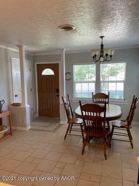 5003 Parker Street Amarillo, TX 79110 - Photo 5 of 20 a view of a dining room with furniture and windows