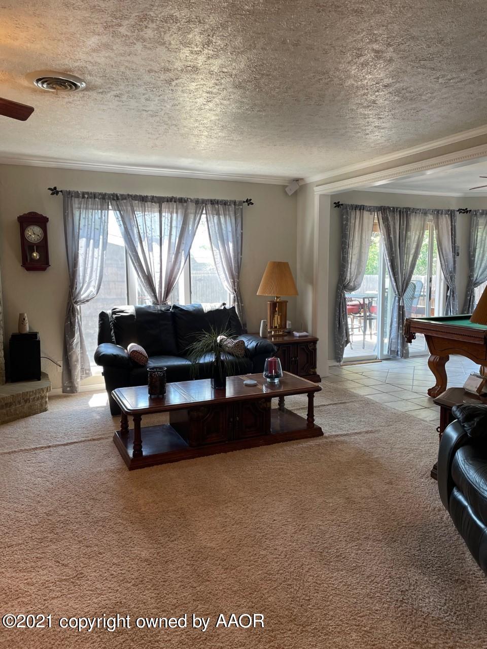 5003 Parker Street Amarillo, TX 79110 - Photo 8 of 20 a living room with furniture and a large window