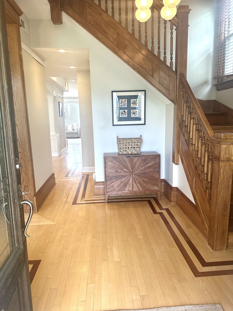 1241 Maple Avenue Wilmette, IL 60091 - Photo 2 of 13 a spacious bedroom with a bed and a couch
