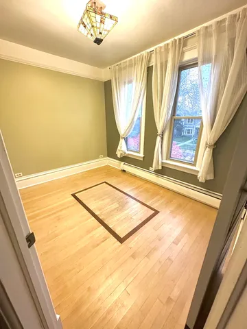 a view of an empty room with windows