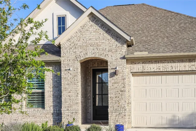 a view of building with a door and windows