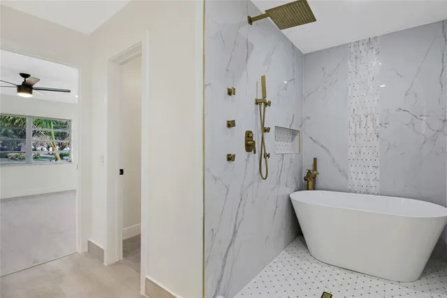 a white bath tub sitting in a bathroom