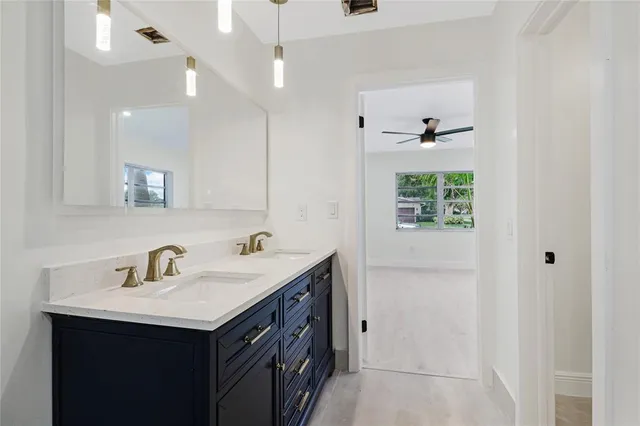 a bathroom with a sink double vanity and a shower