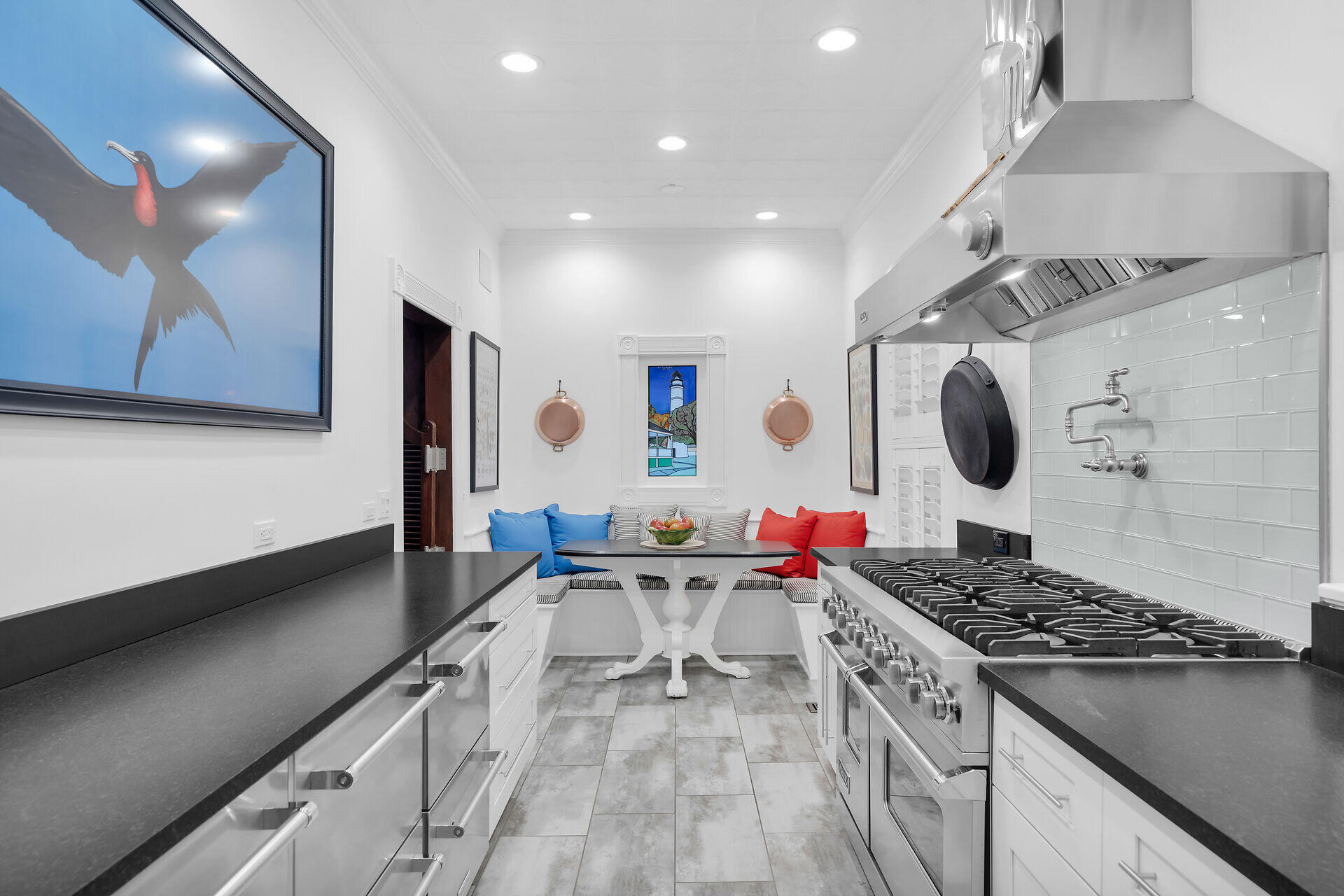 626 Grinnell Street Key West, FL 33040 - Photo 12 of 40 a kitchen with a stove and a wooden floor