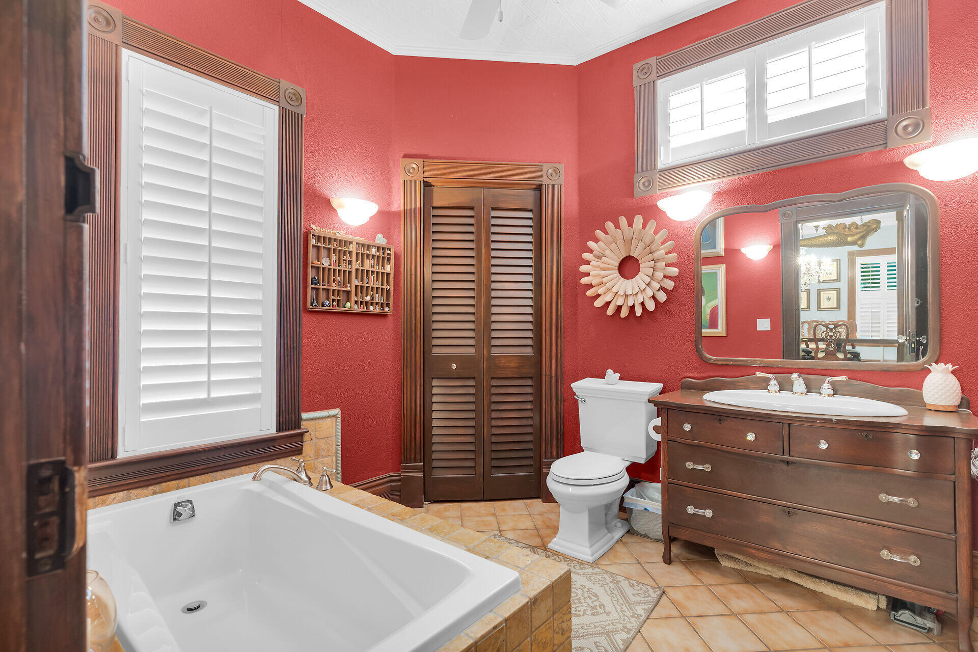 626 Grinnell Street Key West, FL 33040 - Photo 8 of 40 a bathroom with a sink mirror and toilet