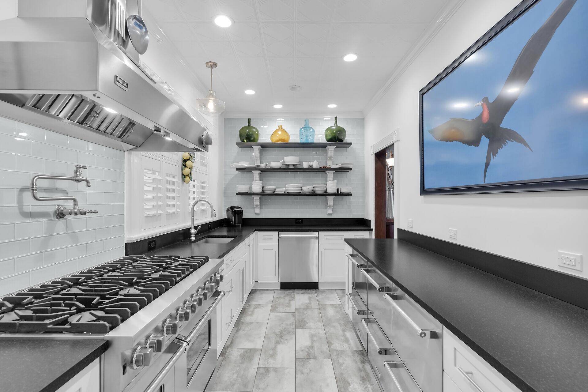 626 Grinnell Street Key West, FL 33040 - Photo 9 of 40 a kitchen with counter top space and stainless steel appliances