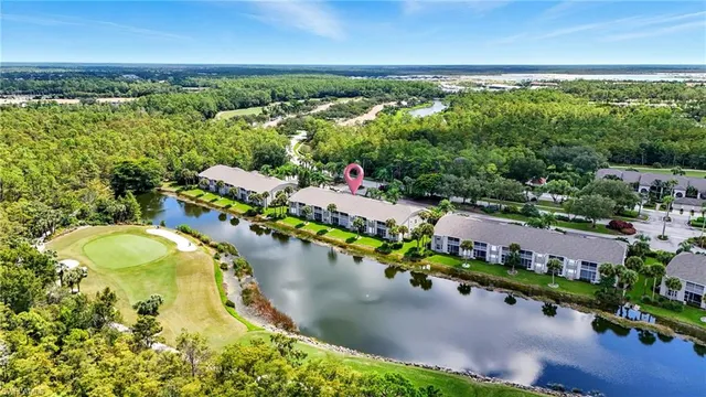 an aerial view of a house with a swimming pool