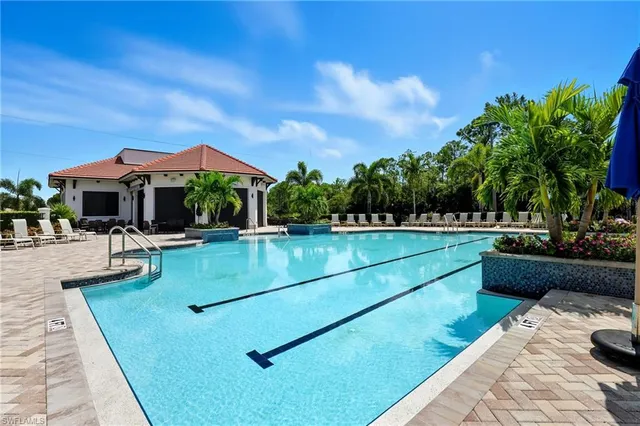 a view of a swimming pool with lounge chair