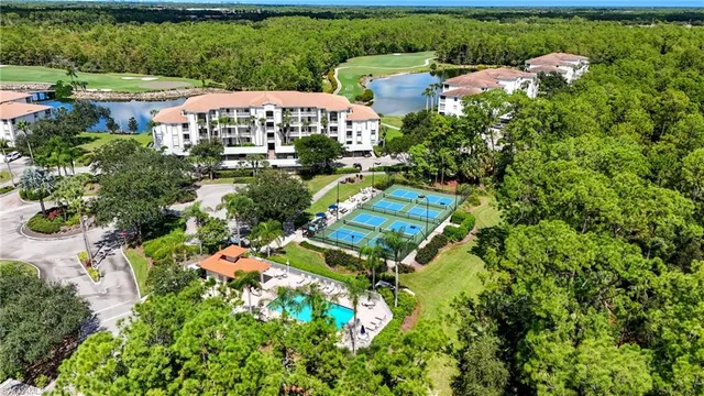 an aerial view of residential houses with outdoor space and street view