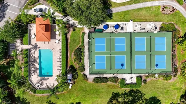 a sign that is sitting in front of a house