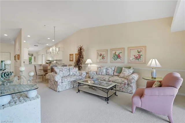 a living room with furniture and a table