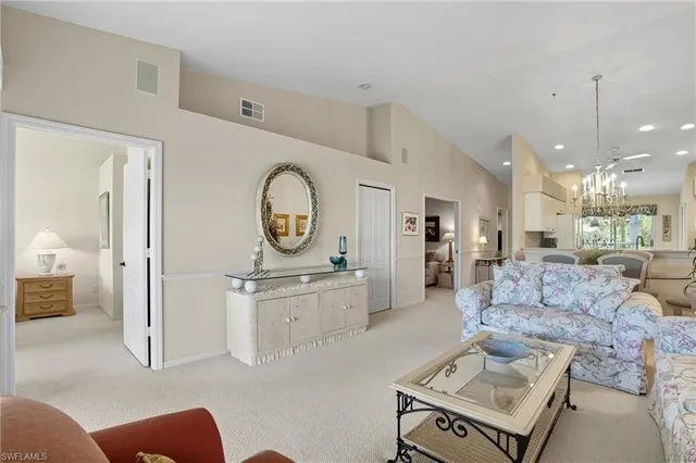 a living room with furniture and a clock
