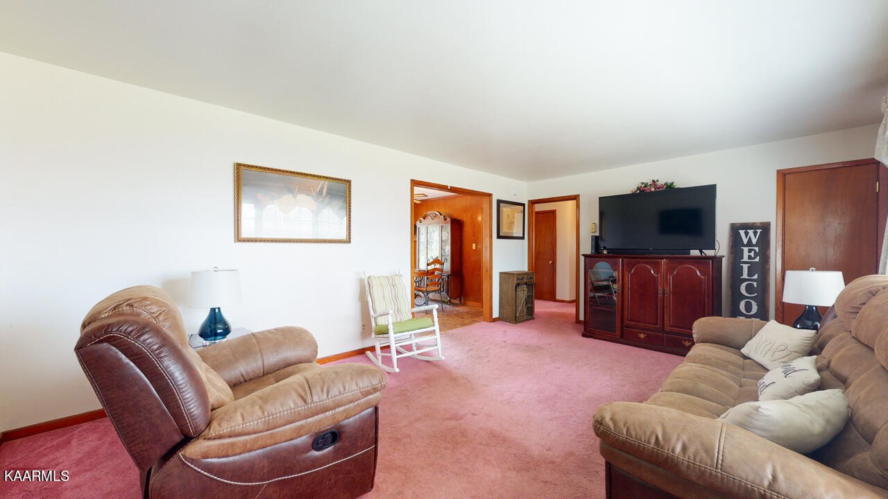 5409 Bluefield Road Knoxville, TN 37921 - Photo 12 of 33 a living room with furniture and a flat screen tv