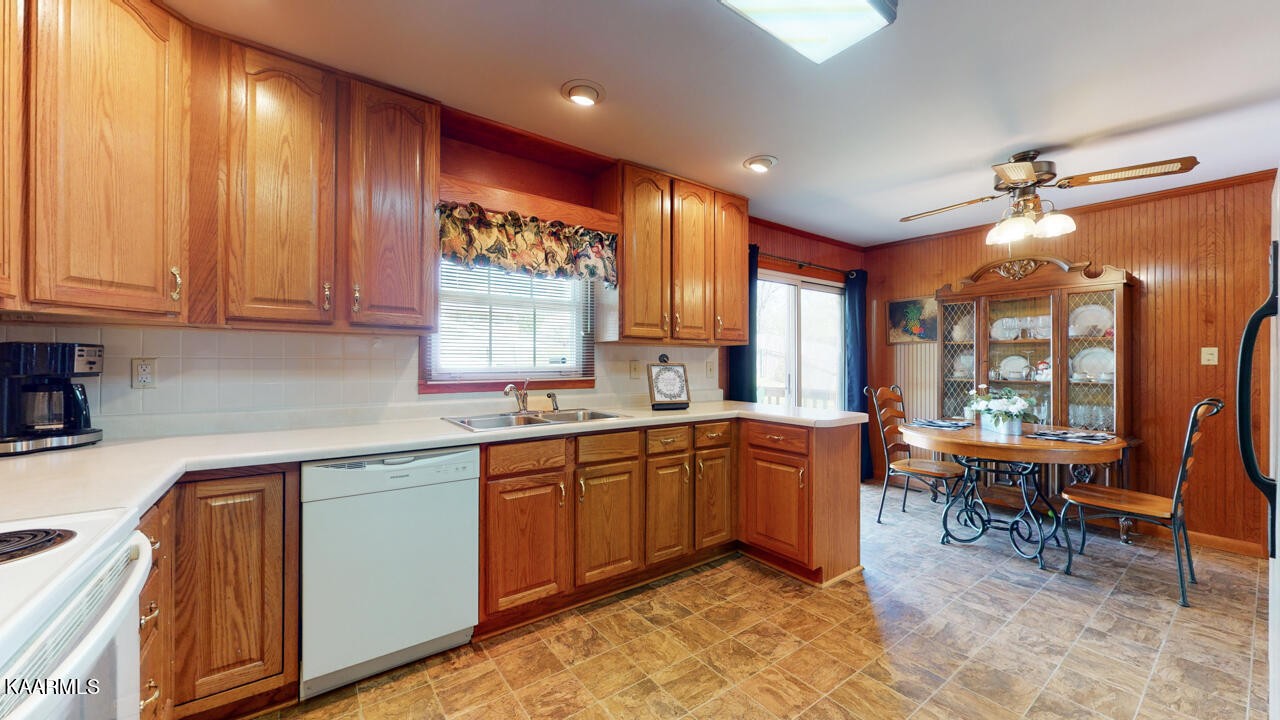 5409 Bluefield Road Knoxville, TN 37921 - Photo 15 of 33 a kitchen with stainless steel appliances granite countertop sink cabinets and wooden floor