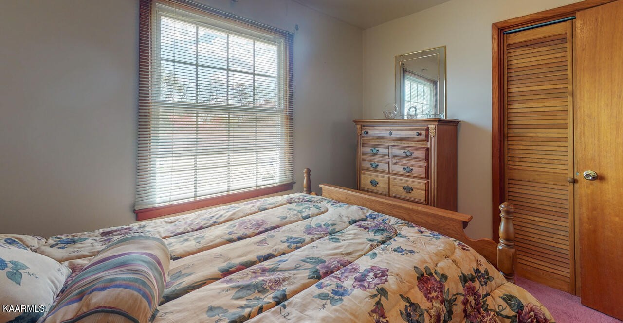 5409 Bluefield Road Knoxville, TN 37921 - Photo 26 of 33 a bedroom with a bed and a window