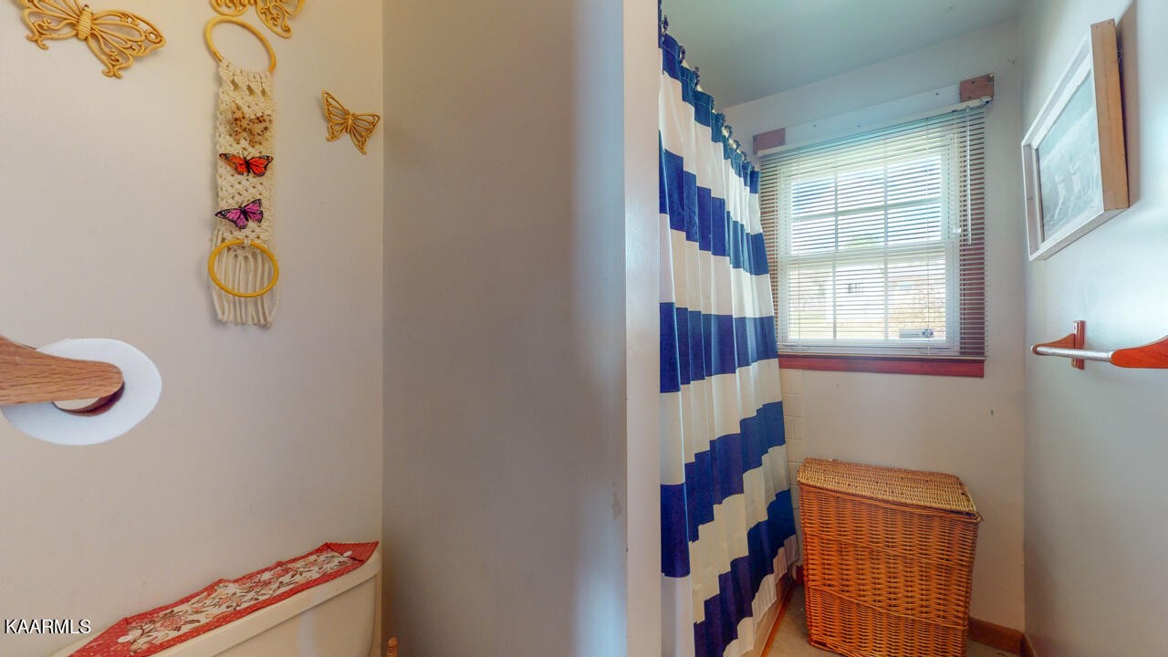 5409 Bluefield Road Knoxville, TN 37921 - Photo 28 of 33 a room that has a window and a white cabinet