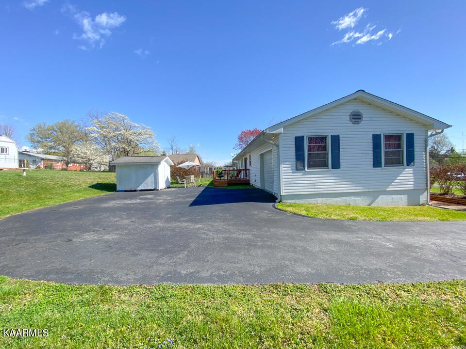 5409 Bluefield Road Knoxville, TN 37921 - Photo 7 of 33 a view of a house with backyard and swimming pool