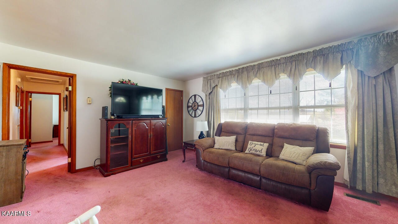 5409 Bluefield Road Knoxville, TN 37921 - Photo 10 of 33 a living room with furniture and a flat screen tv